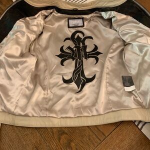 Women’s Rare vintage Wilson’s studded and distressed leather motorcycle jacket.